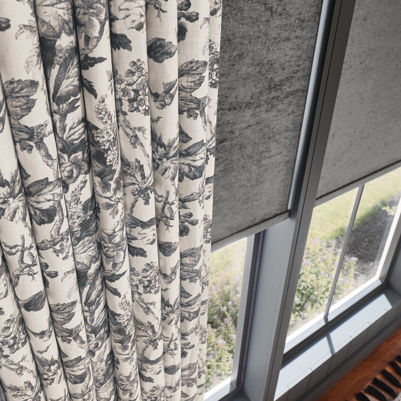 floral curtains and shade blinds on a window