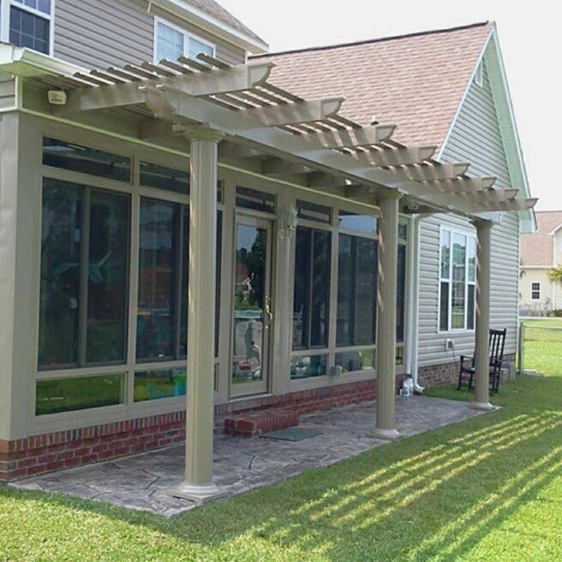 pergola on the back patio of a house